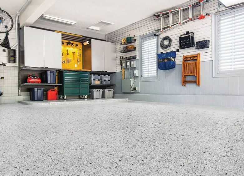 Light partial-flake garage floor with base color visible